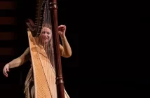 Harpist Bridget Kibbey on stage at Koerner Hall