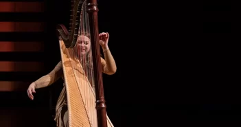 Harpist Bridget Kibbey on stage at Koerner Hall